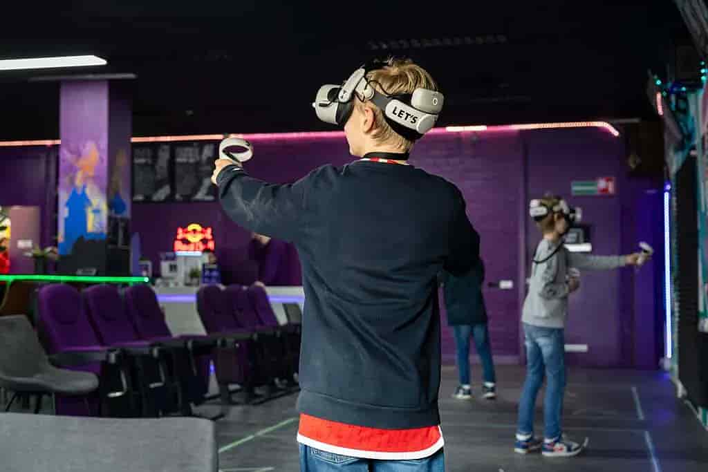 Children experiencing virtual reality with VR headsets
