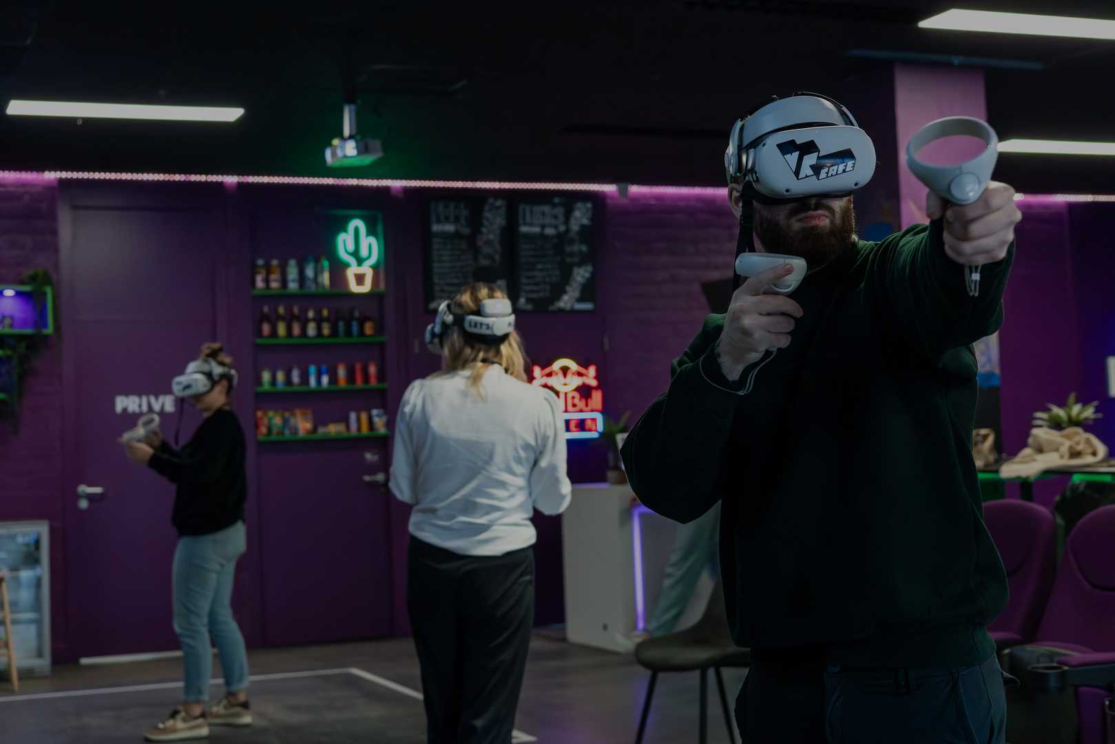 A father playing VR with two girls